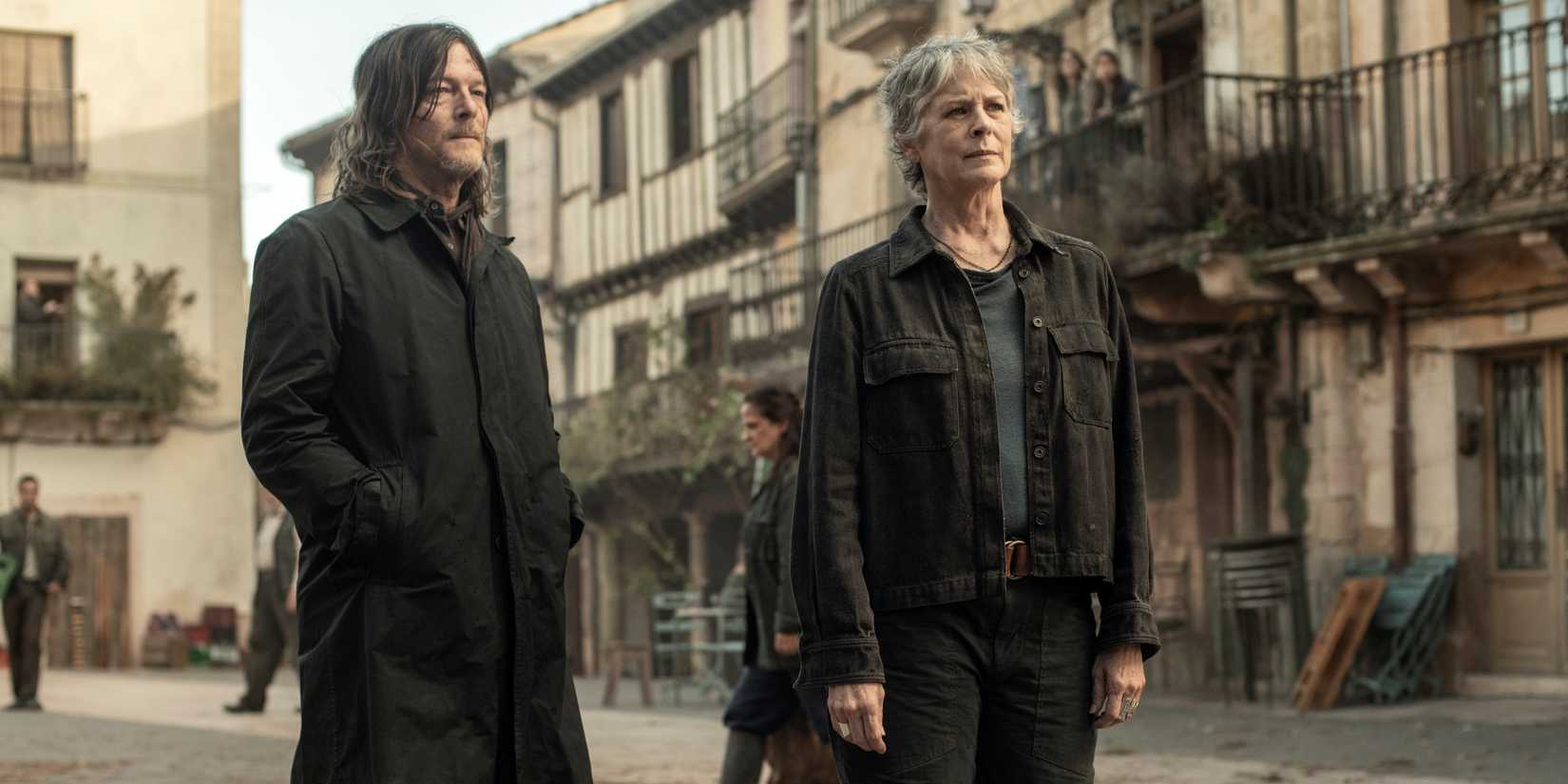 Melissa McBride as Carol with Norman Reedus as Daryl with hands in pockets in The Walking Dead: Daryl Dixon