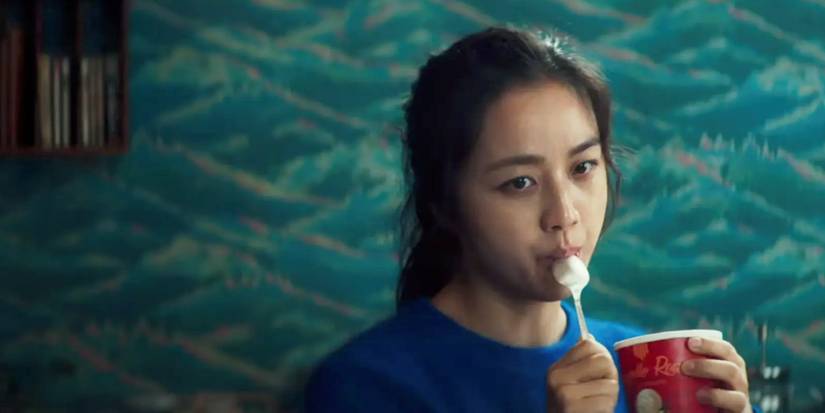 Tang Wei licking a spoon in Decision to Leave