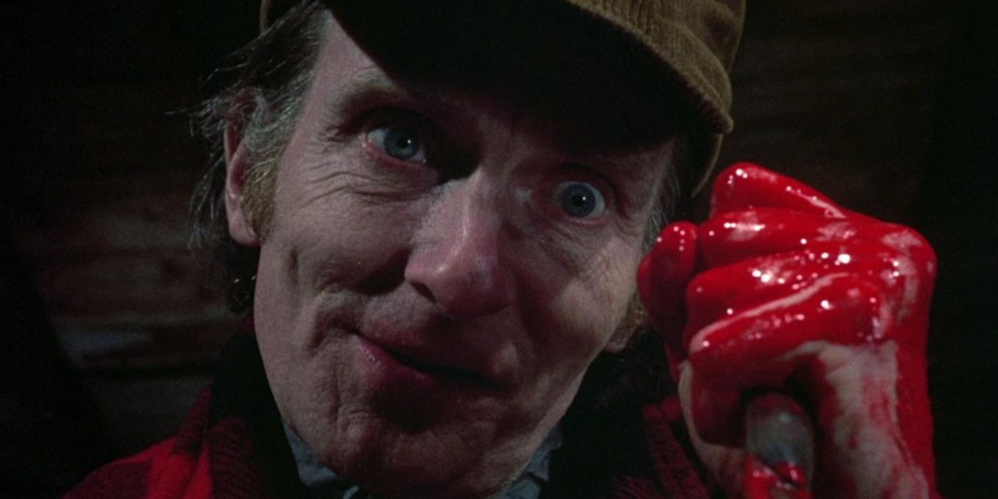 Roberts Blossom as Ezra Cobb with blood on his hand in Deranged: Confessions of a Necrophile,