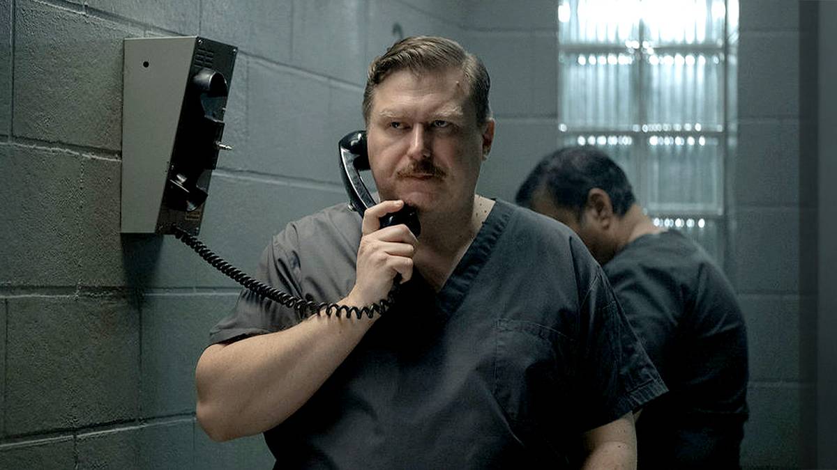 John Wayne Gacy on a phone in jail