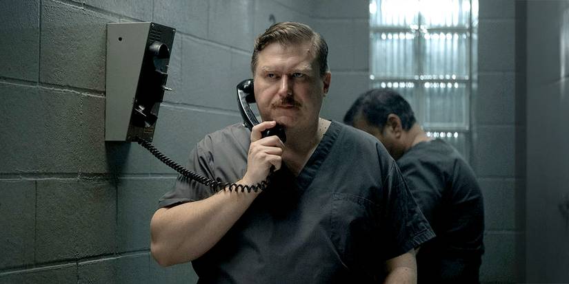 John Wayne Gacy on a phone in jail