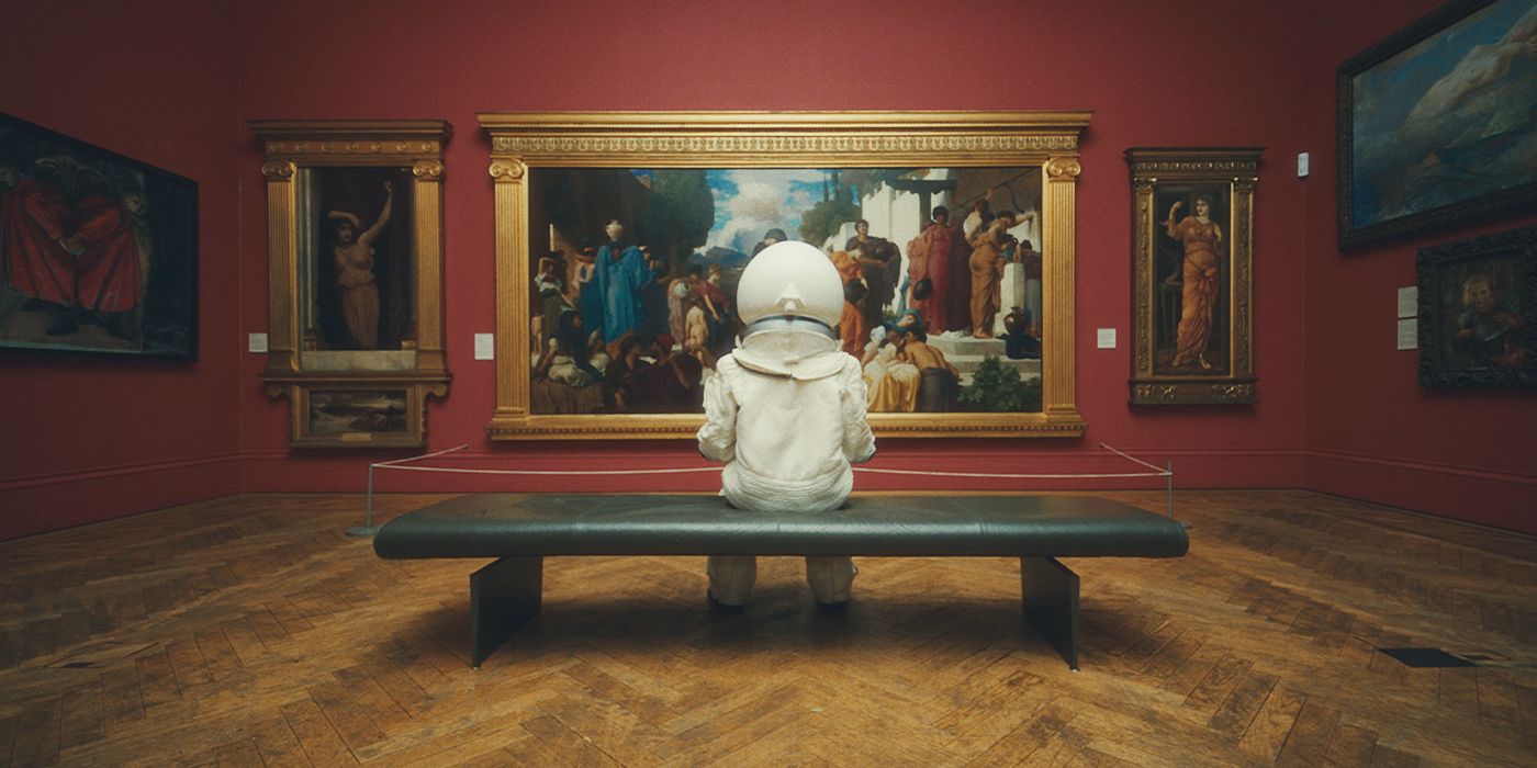An astronaut sitting in an art gallery in Gustaffson's Dance to the Algorithm music video