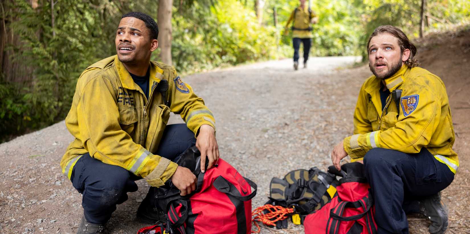 Jordan Calloway as Jake and Max Thieriot as Bode on Fire Country