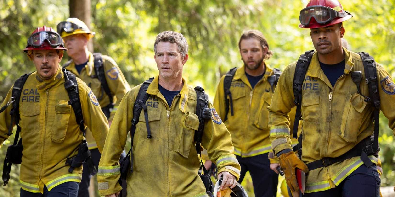 Shawn Hatosy as Battalion Chief Richards walking with Max Thieriot and Jordan Calloway in Fire Country