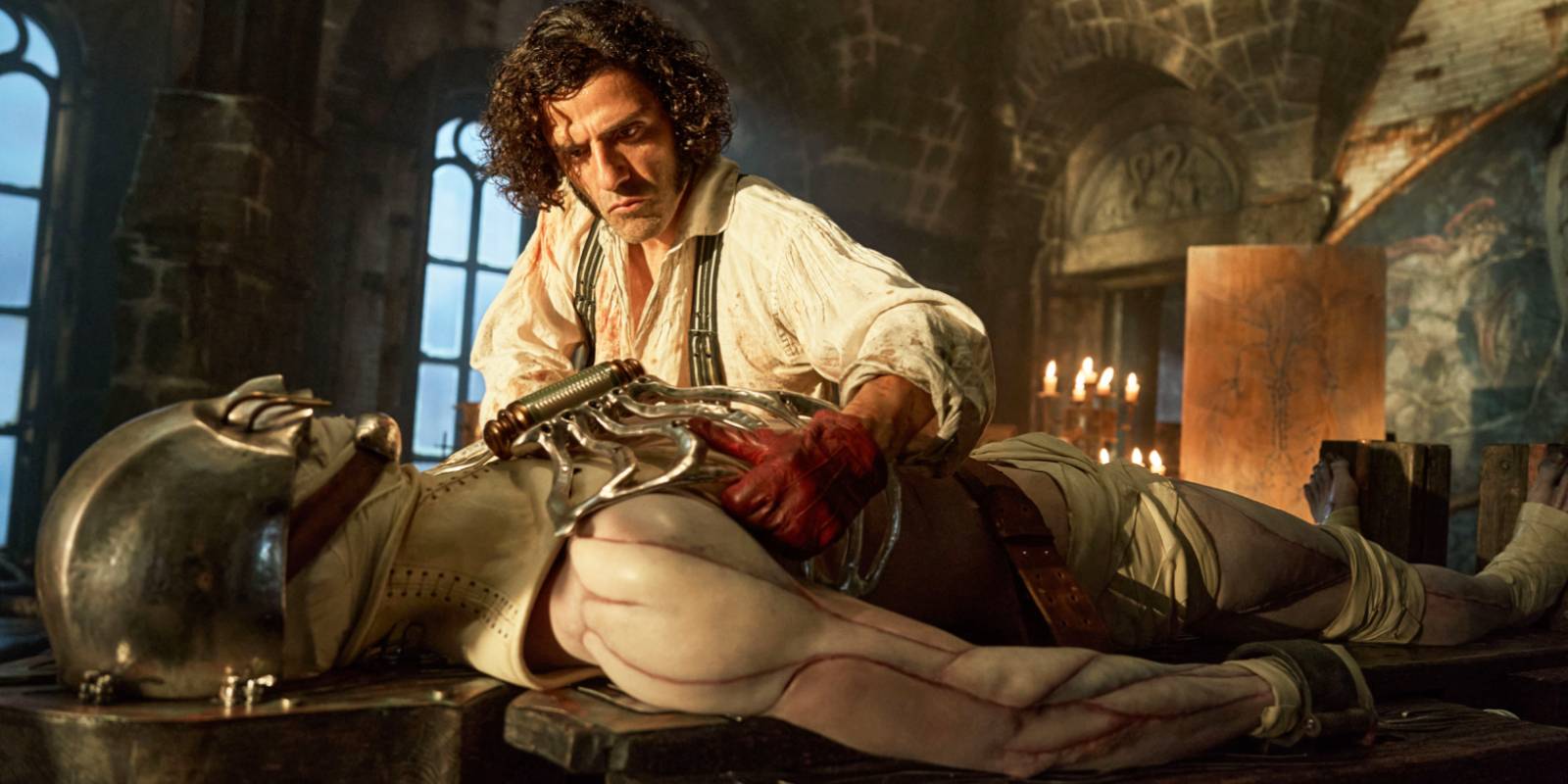 Victor Frankenstein (Oscar Isaac) creates his Creature (Jacob Elordi) in 'Frankenstein' (2025).