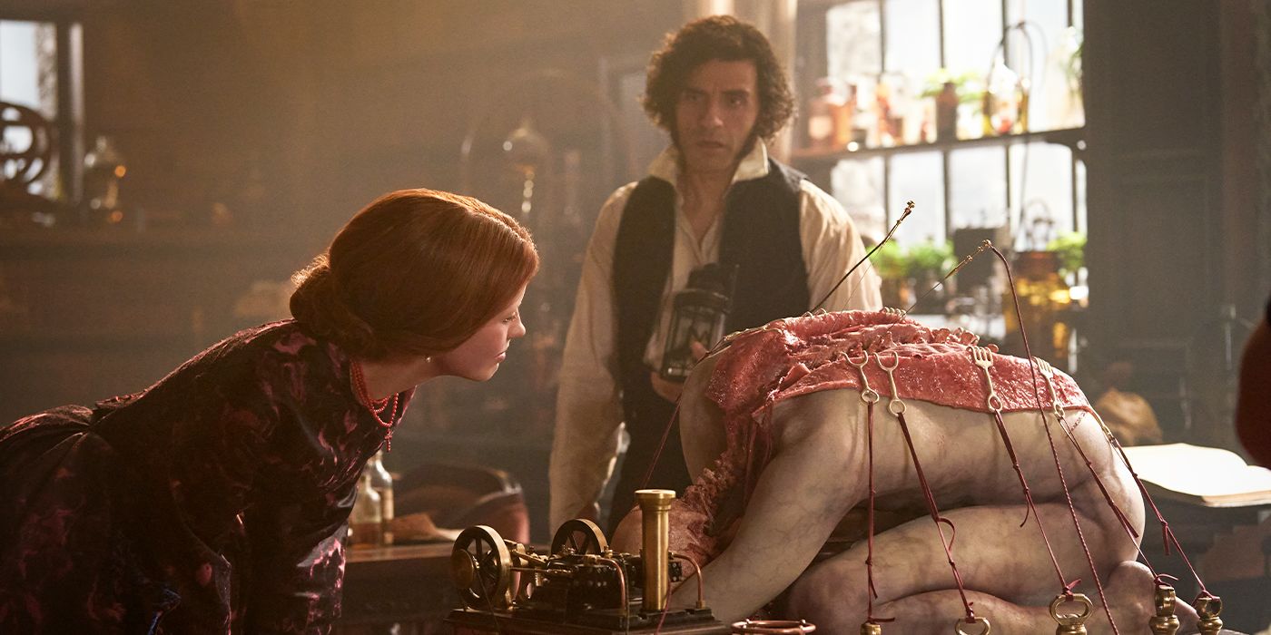 Elizabeth examines one of Victor's experiments on a body that's cut open on a table. 