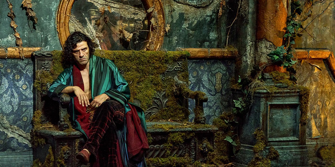 Victor Frankenstein scowls on a bench overgrown with moss in an open silk robe and velvet pants.
