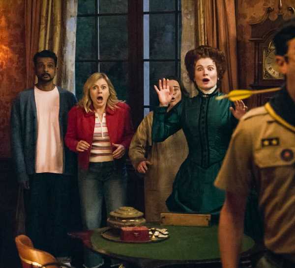 Ghosts Season 5 ensemble standing in the basement