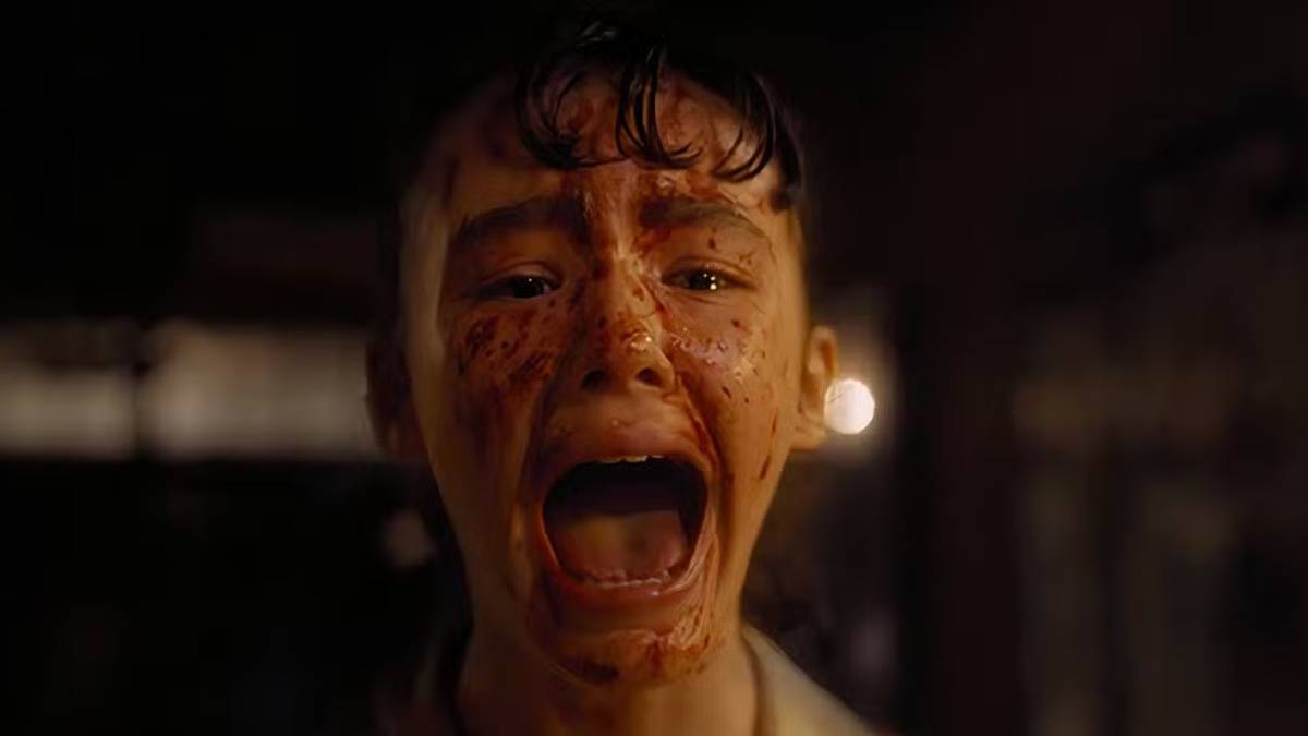 Lilly (Clara Stack) screaming with blood on her face in 'It: Welcome to Derry'