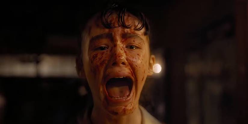 Lilly (Clara Stack) screaming with blood on her face in 'It: Welcome to Derry'