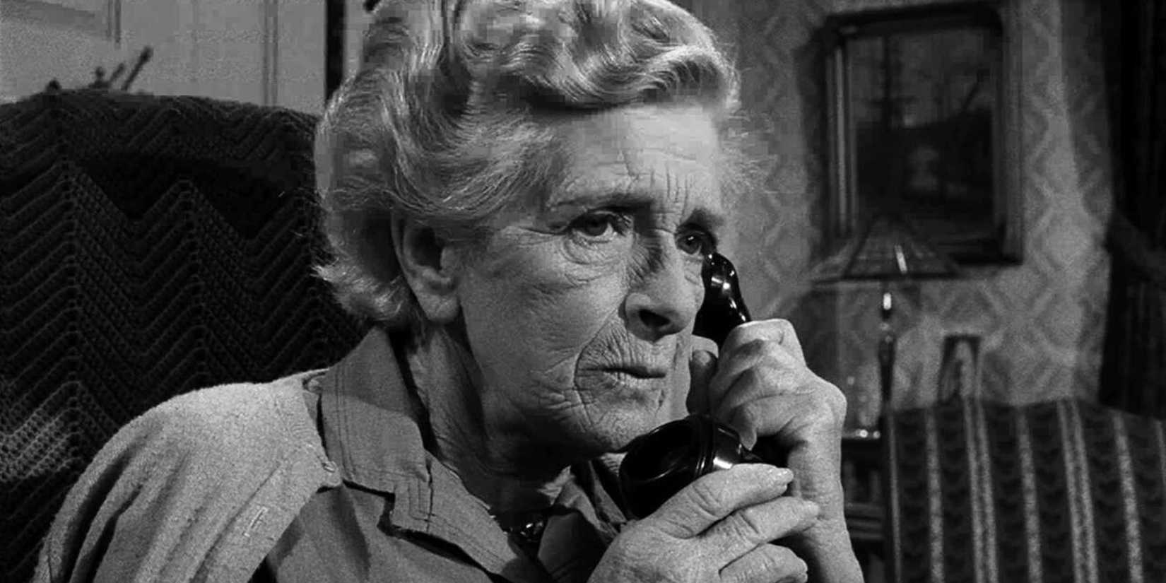 Gladys Cooper sitting down while on the phone in The Twilight Zone episode Night Call.