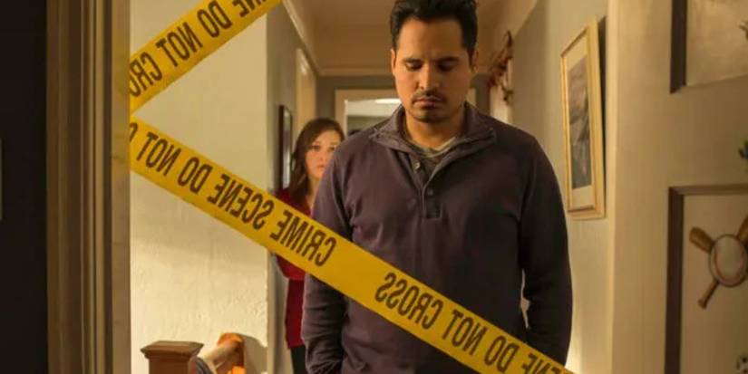 Virginia Kull and Michael Peña as Beth and Mark Solano in a home with crime scene tape on Gracepoint.
