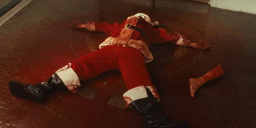 Art the Clown making a blood angel in the aftermath of the shower massacre in 'Terrifier 3.'