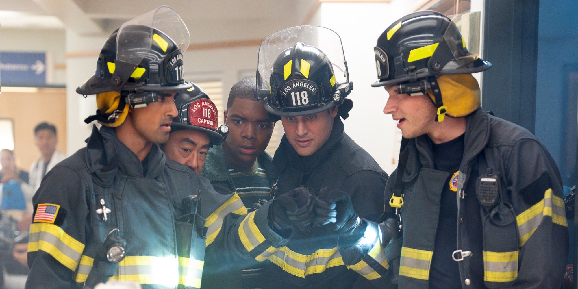 Ravi, Chimney, Harry, Eddie, and Buck clustering around a patient in 9-1-1 Season 9