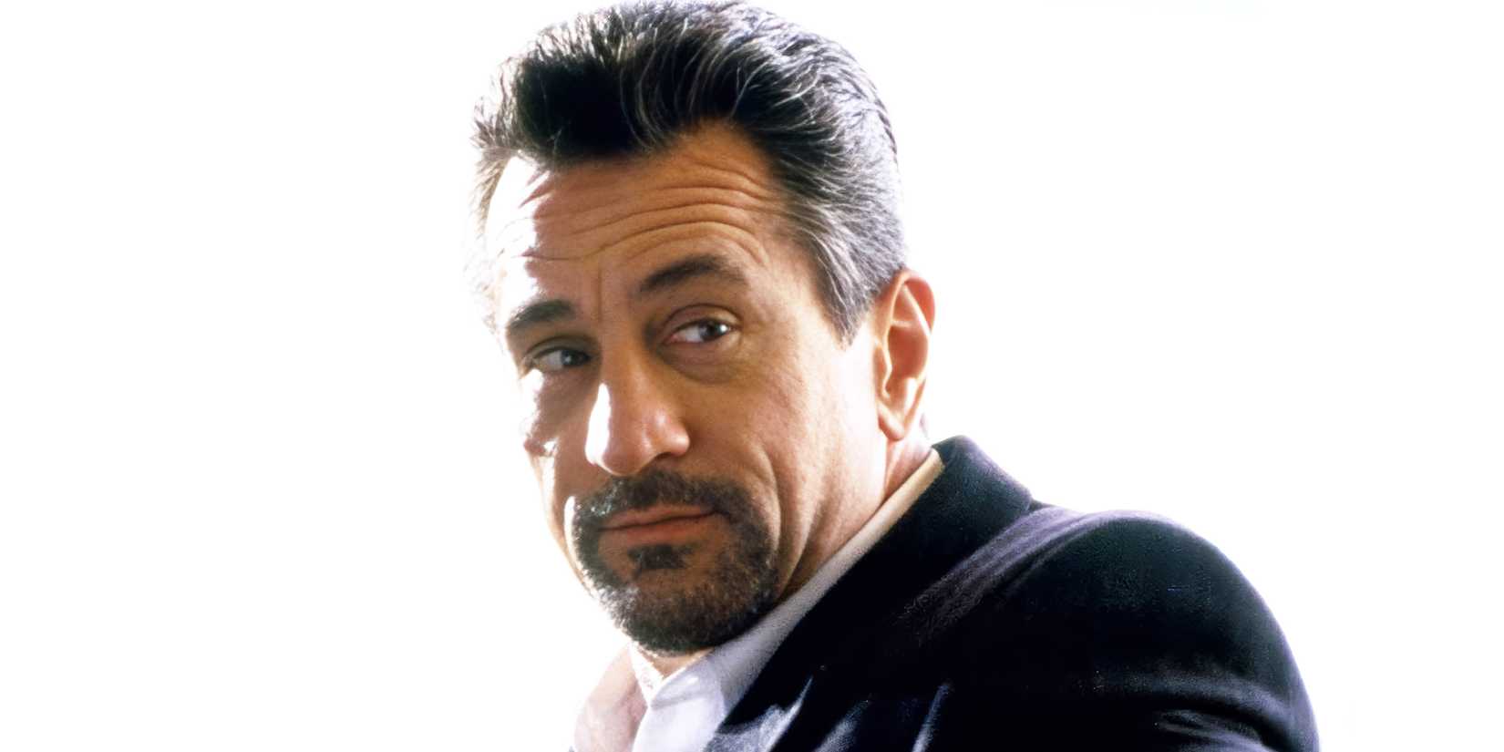 Robert De Niro smirking in Heat