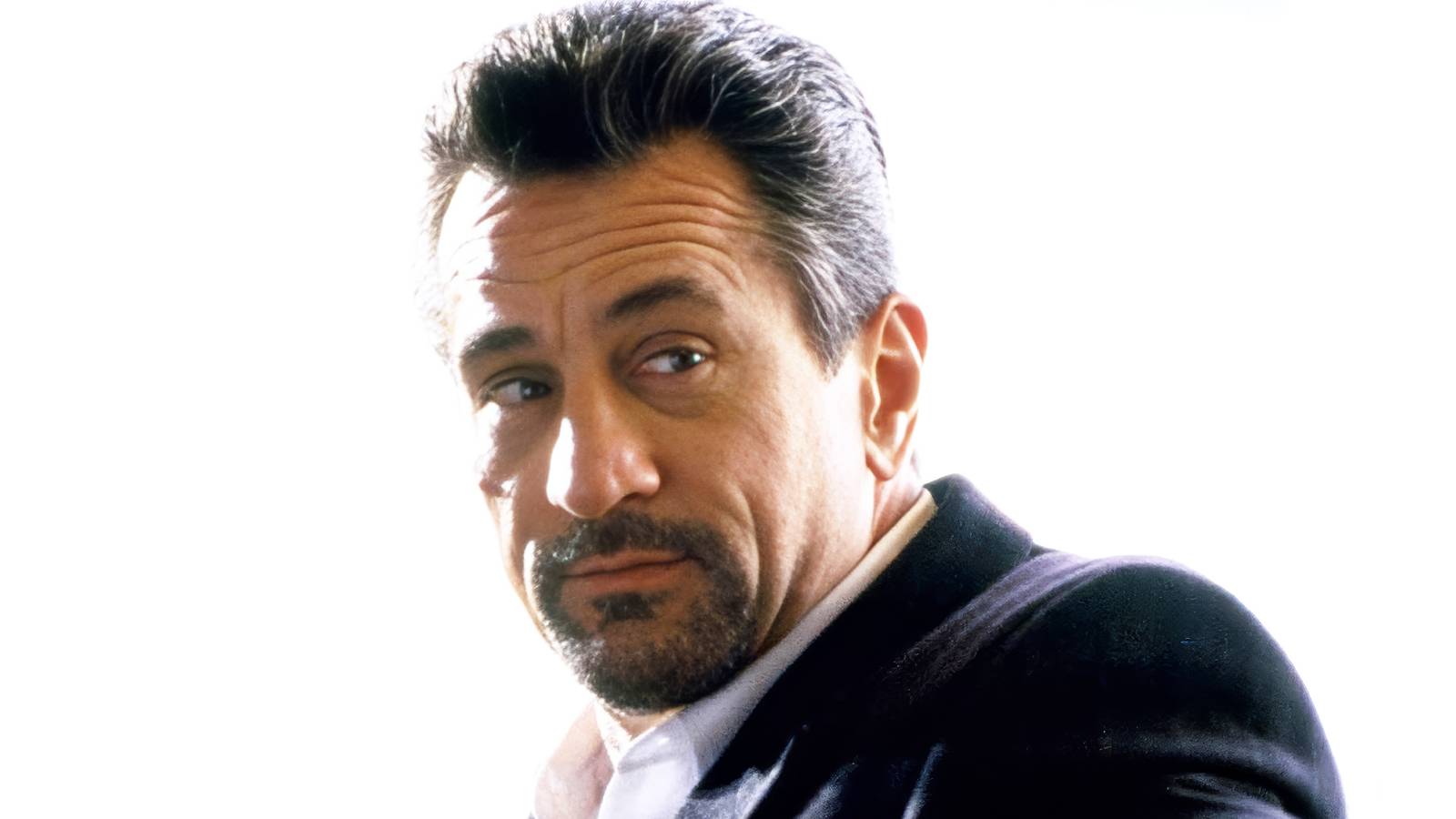Robert De Niro smirking in Heat