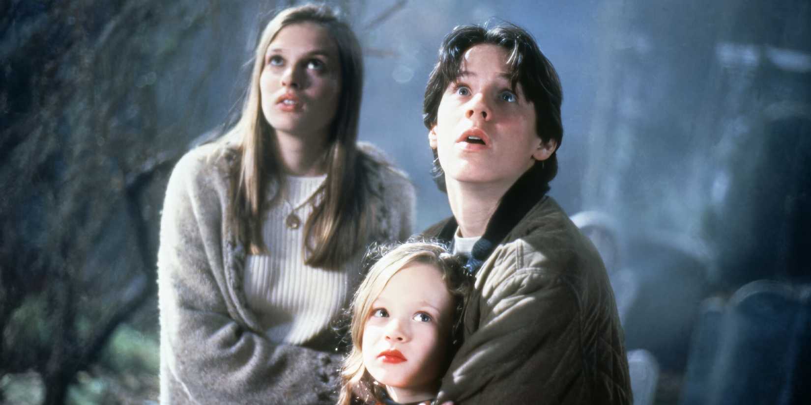 Vinessa Shaw, Omri Katz, and Thora Birch looking up in surprise in Hocus Pocus