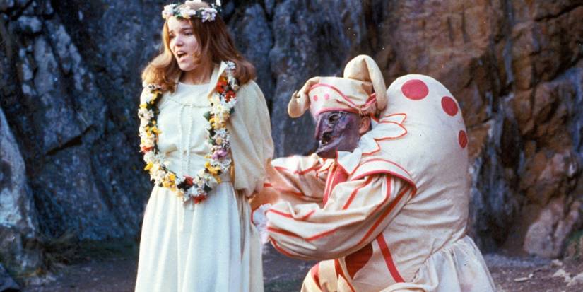 A girl is tied up by a person in a costume in The Wicker Man