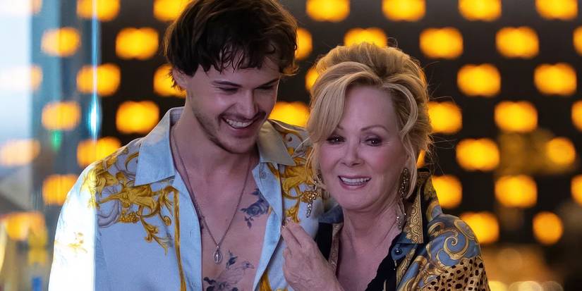 Jean Smart and Christopher Briney are grinning amid filming of Hacks Season 5.