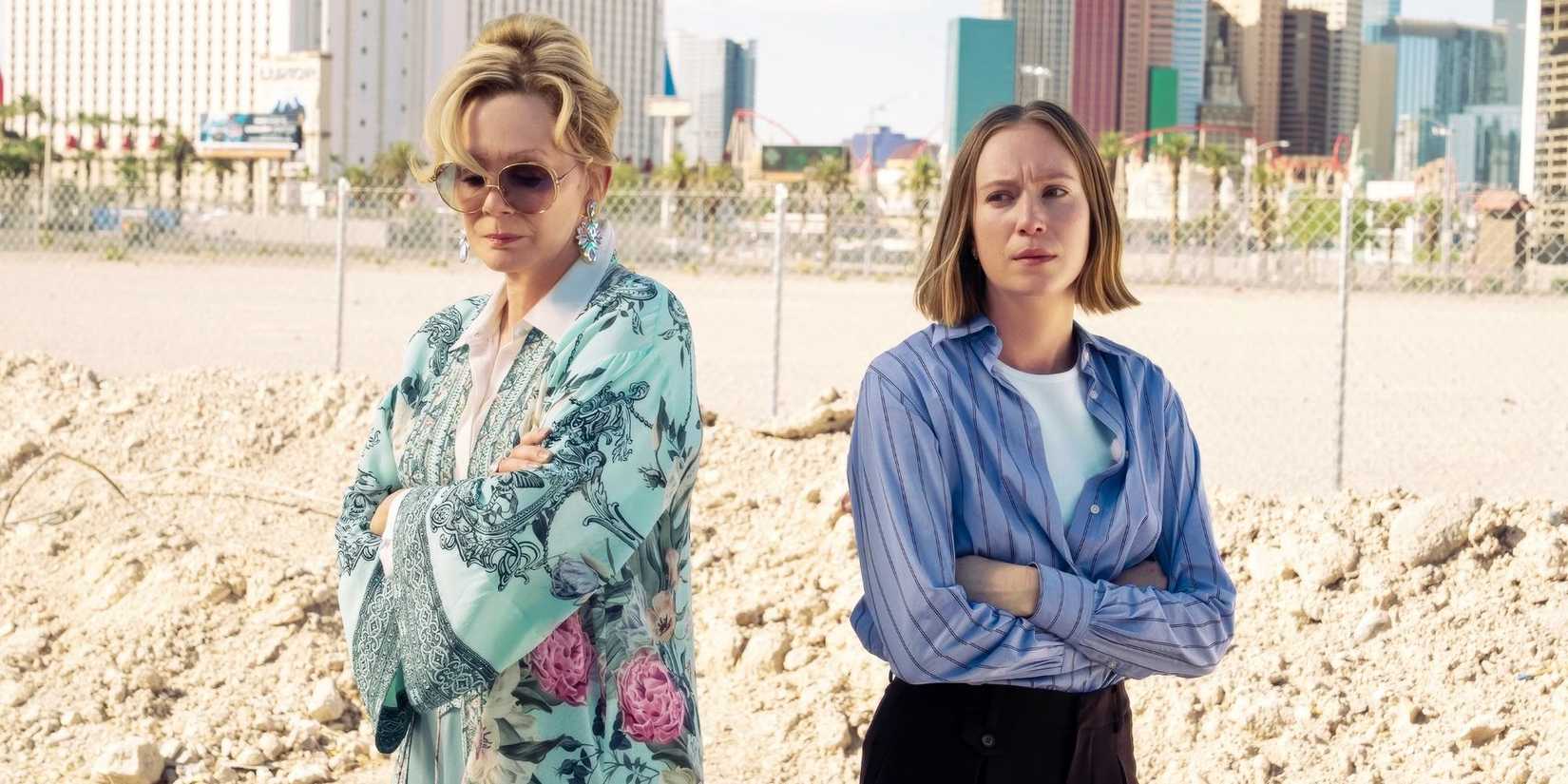 Jean Smart and Hannah Einbinder backs to each other with crossed arms on a beach in Season 4 of Hacks.