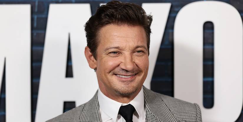 Jeremy Renner smiling and posing at the Mayor of Kingstown Season 4 premiere Q&A.