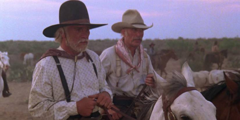 Tommy Lee Jones as Captain Woodrow F. Call and Robert Duvall as Captain Augustus "Gus" McCrae on horseback in 'Lonesome Dove' (1989)