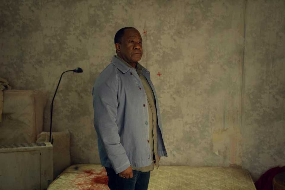 Lucian Msamati stood next to a bloody mattress in Run Away
