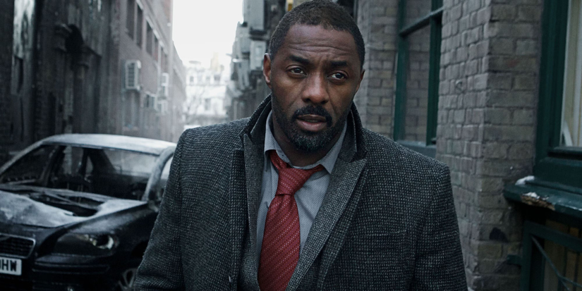 DCI John Luther (Idris Elba) wanders down an alley in Luther.