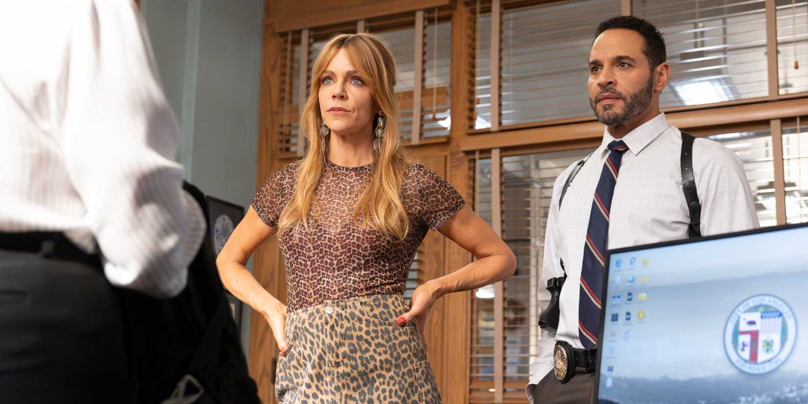 Morgan Gillory and Adam Karadec standing together in the precinct and looking serious in High Potential Season 2