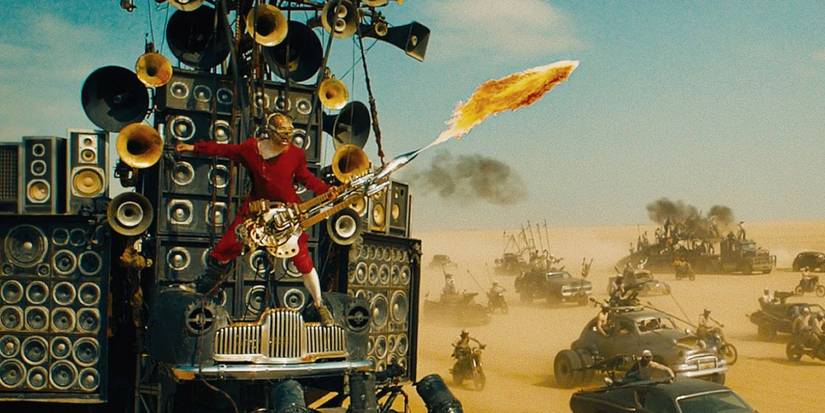 The Doof Warrior playing his custom guitar in Mad Max: Fury Road - 2015