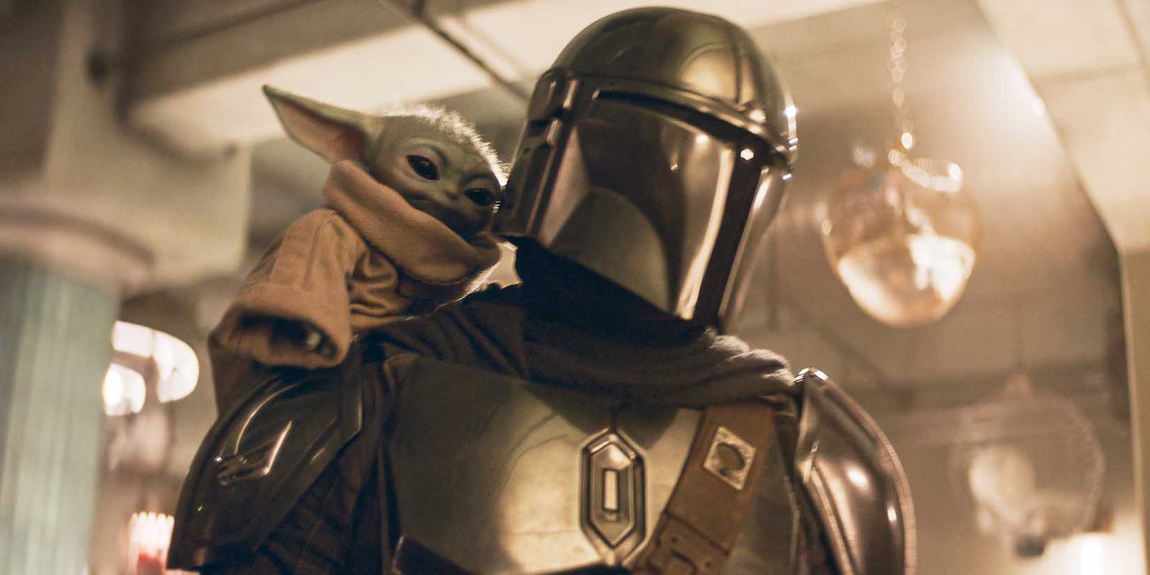 Pedro Pascal as Mando with Grogu on his shoulder in The Mandalorian and Grogu.