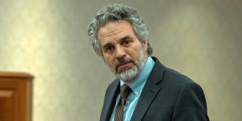 Mark Ruffalo as Tom Brandis in a suit and tie while giving a statement about his son at his sentencing in Task.