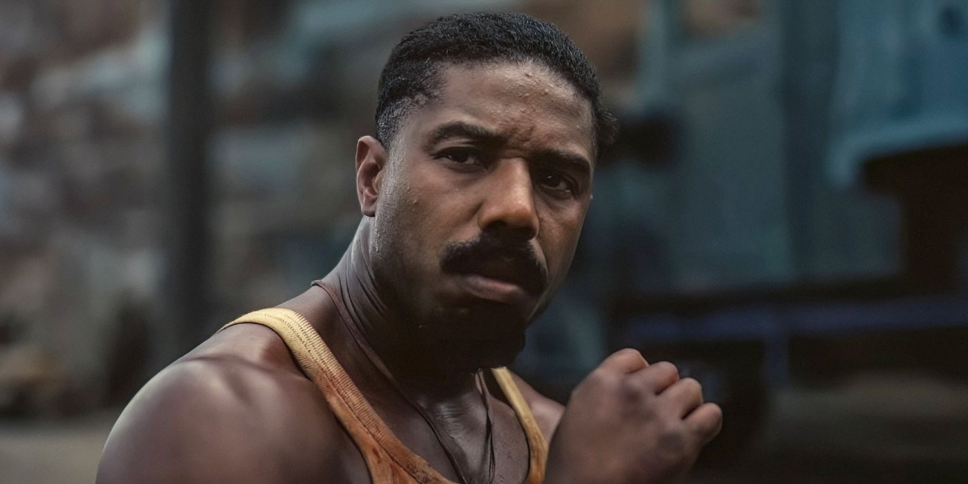 Michael B. Jordan in 'Sinners' smoking a cigarette outside, after a bloodbath the night before