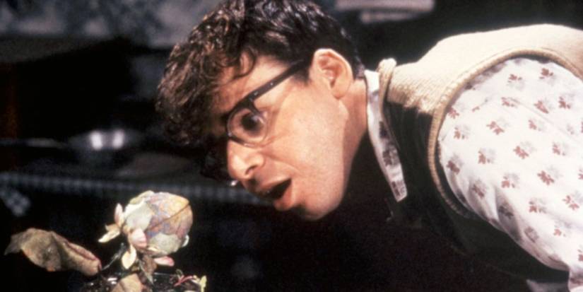 Rick Moranis looking at his deadly plant in Little Shop of Horrors.