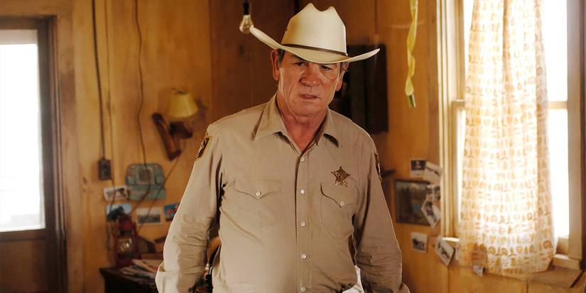 Tommy Lee Jones as Ed Tom Bell in the sheriff's office in No Country for Old Men.