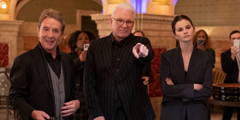 Charles pointing a finger as Mabel, Oliver, and others look on in Only Murders in the Building.