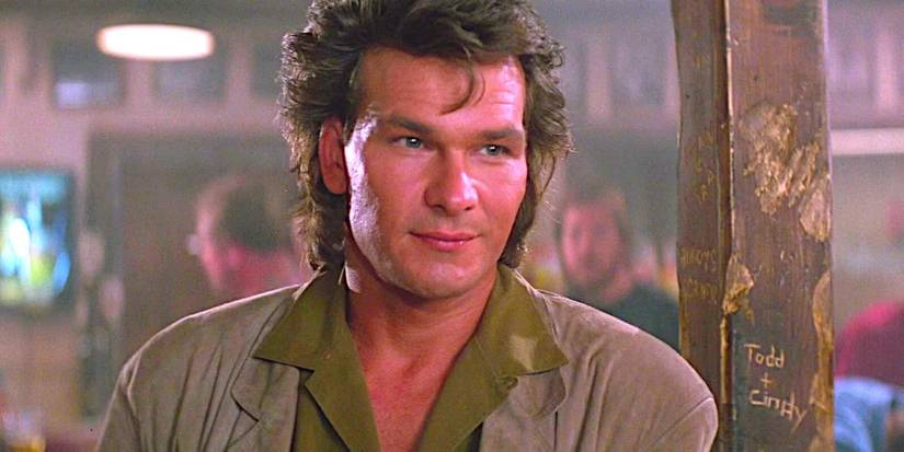 Patrick Swayze smiling in the bar in Road House