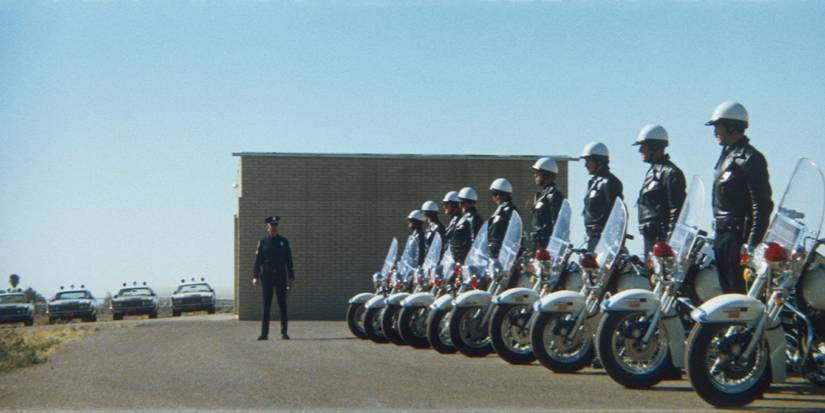 Arizona patrol officers next to their bikes in Electra Glide In Blue (1973)