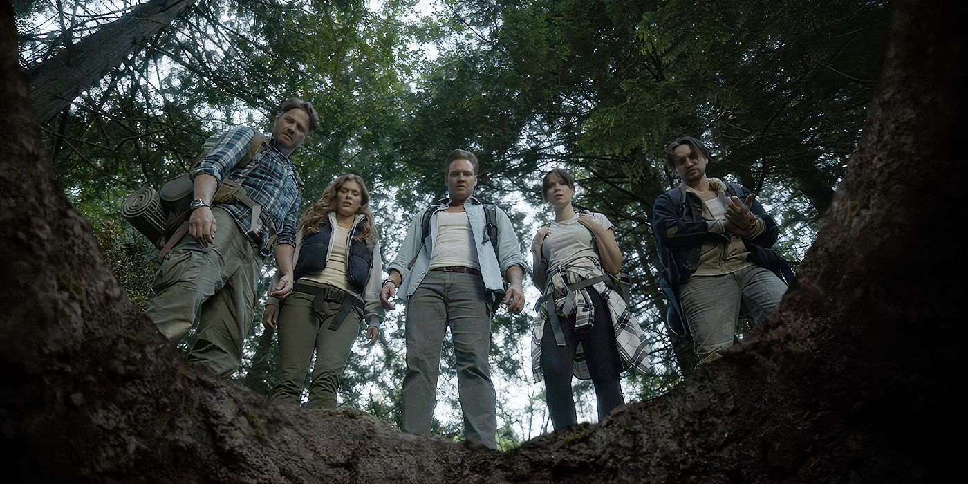 The cast of 'Pitfall' stand around the titular trap and look into its darkness