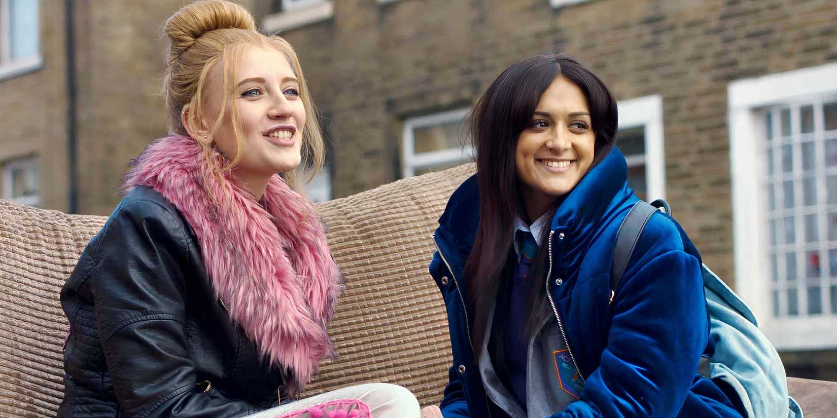 Poppy Lee Friar and Amy-Leigh Hickman in Ackley Bridge smiling.