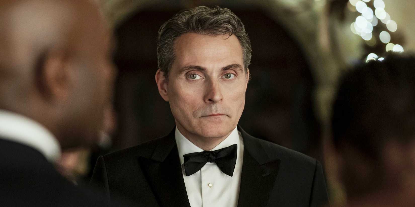Rufus Sewell looks serious at a black tie event in The Diplomat