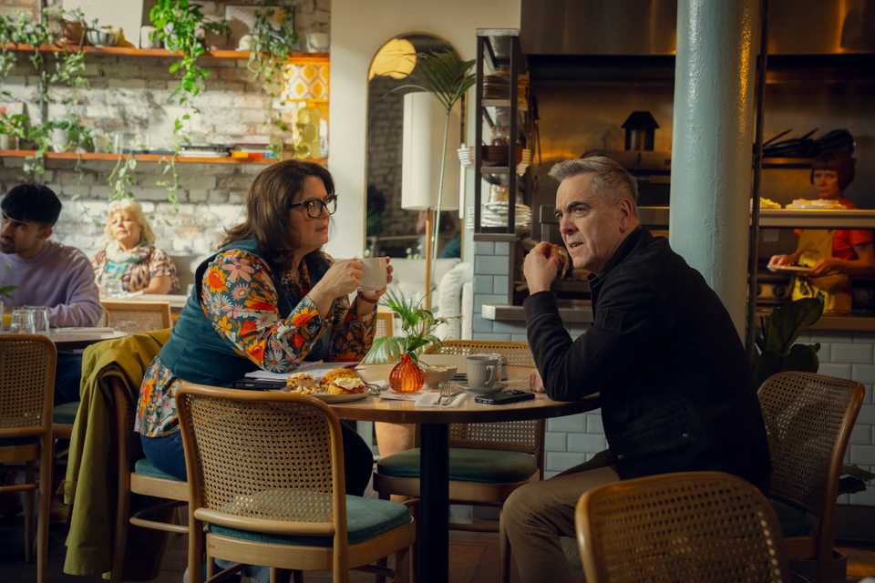 Ruth Jones and James Nesbitt drinking at a cafe in Run Away