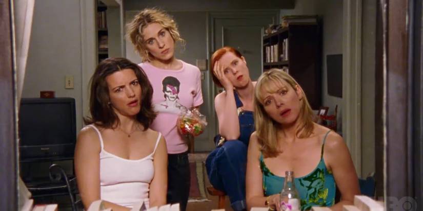 Charlotte, Carrie, Miranda, and Samantha looking out the window in 'Sex and the City'