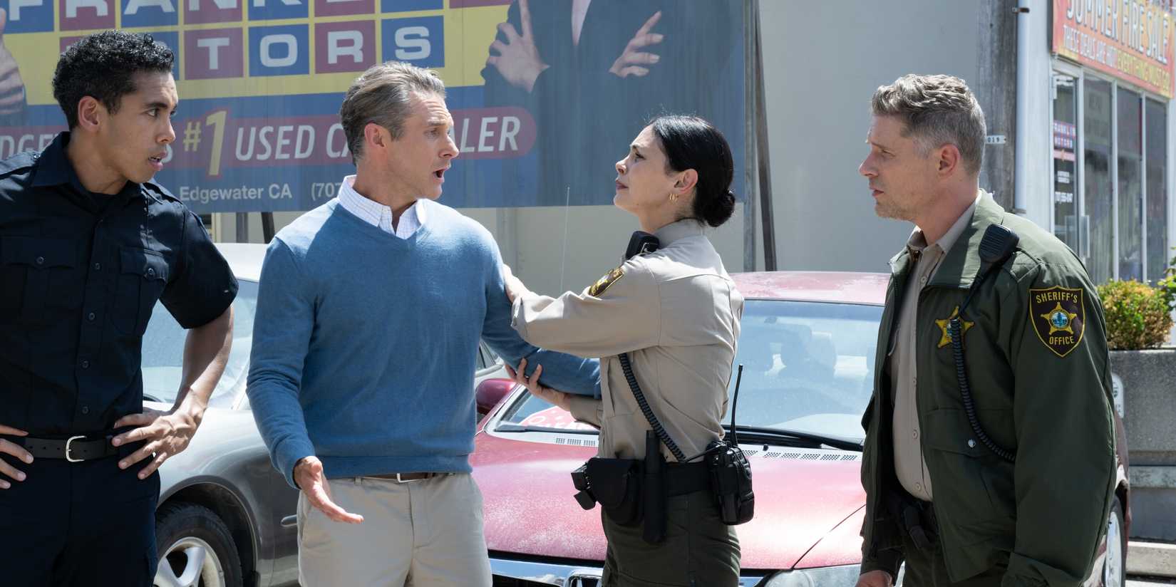 Matt Wells as Tom Walsh, Morena Baccarin as Mickey Fox, and Matt Lauria as Boone on Sheriff Country