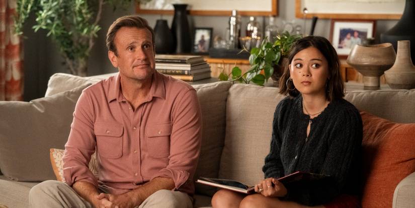 Jason Segel as Jimmy sitting on the couch with Lukita Maxwell as Alice in Shrinking Season 3