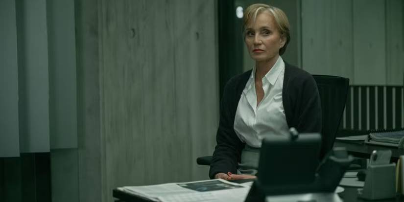 Kristin Scott Thomas as Diana Taverner sits in an office with a serious expression on Slow Horses.