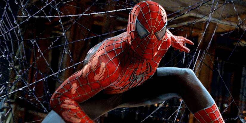 Spider-Man posing atop a cab suspended by webbing in Spider-Man 3