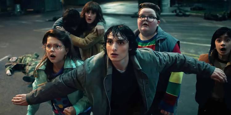 Mike blocks other shocked/scared kids from an unseen attack in Stranger Things