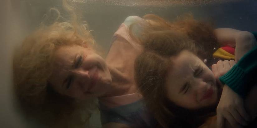 Karen Wheeler and Holly Wheeler hold their breath underwater in Stranger Things Season 5