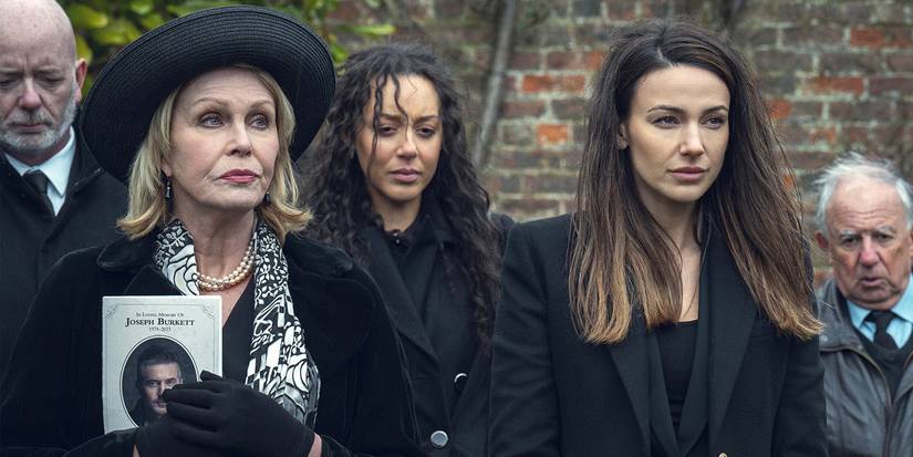 Joanna Lumley and Michelle Keegan in black looking somber at a funeral in Fool Me Once.